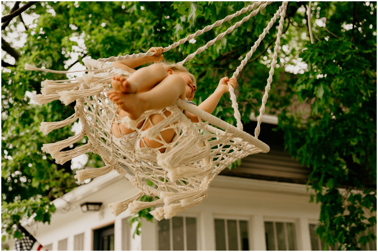 family photographer girl on swing