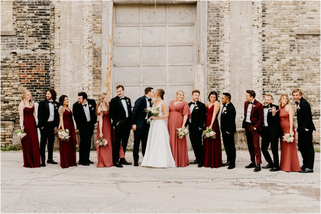 bridal party with red dresses