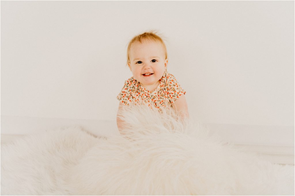 baby smiling at camera