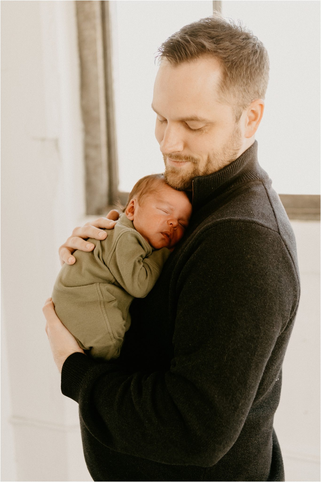 dad holding baby boy