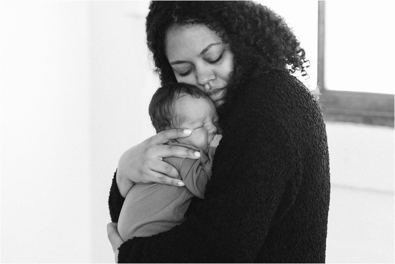 mom holding baby