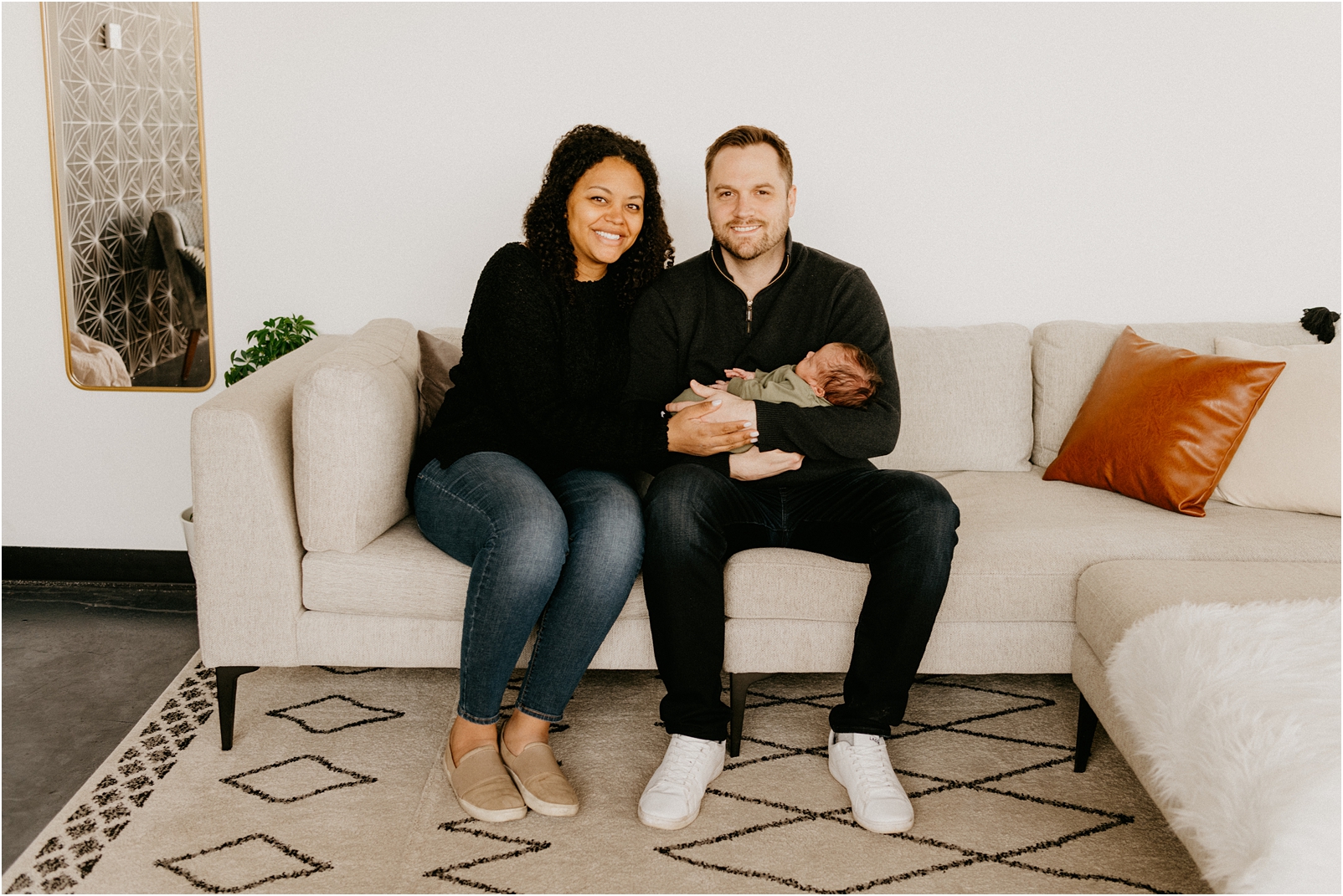family sitting on couch