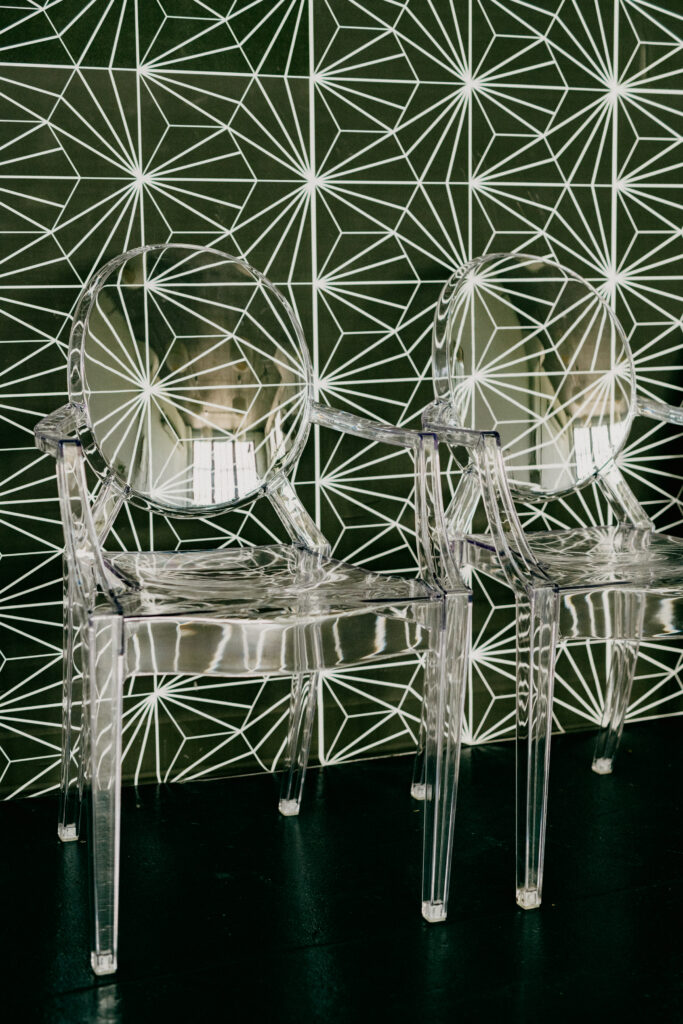ghost chairs with geometric wall