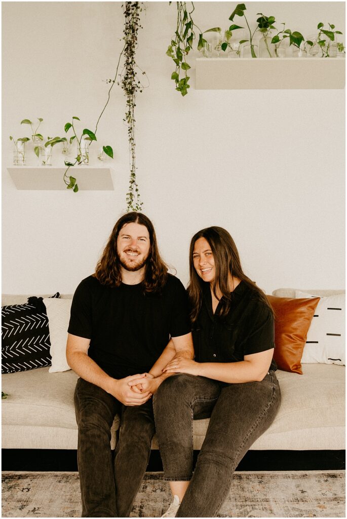 happy couple sitting on couch