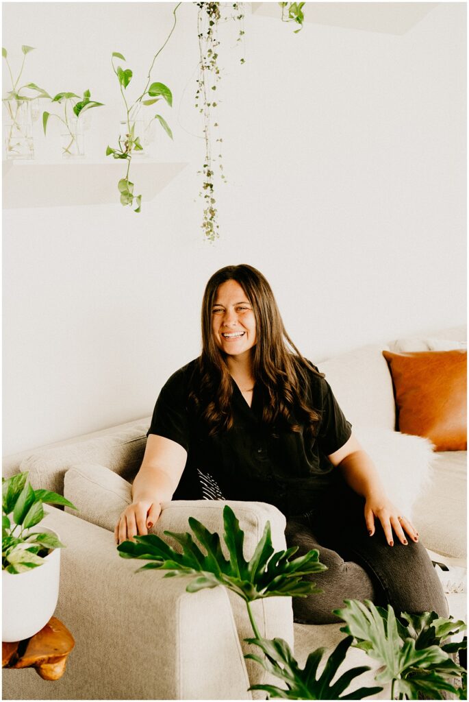 girl sitting on couch with black shirt