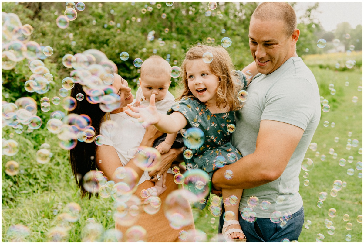 wisconsin family photo with bubbles at a park