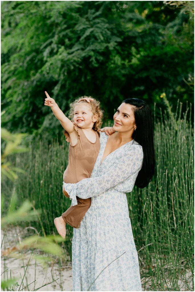 mom and daughter near tall grass