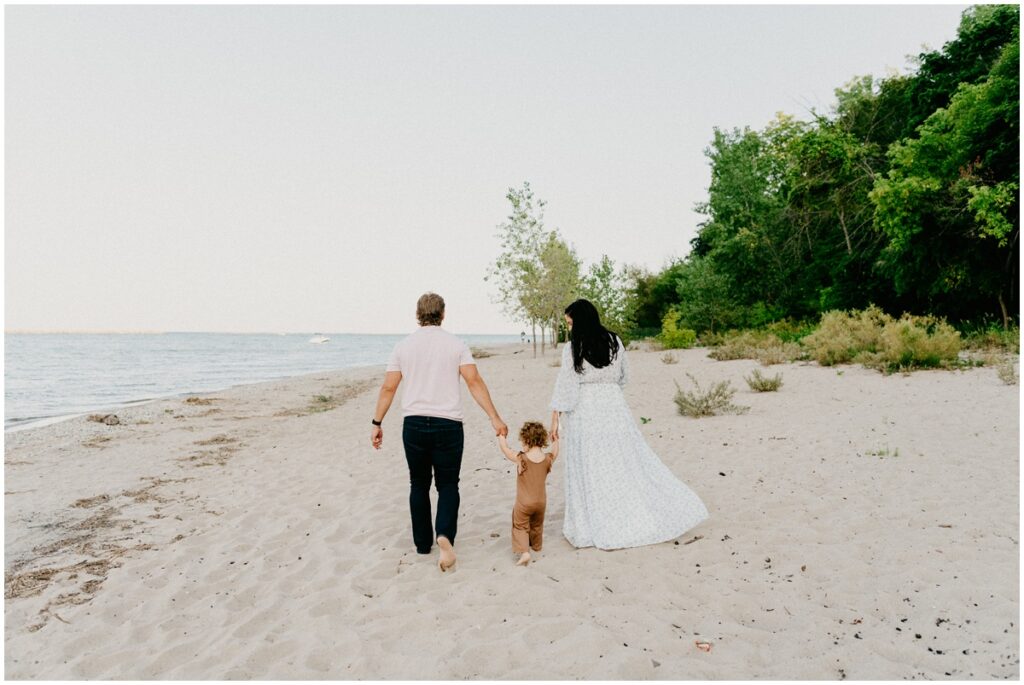 family walking down beach