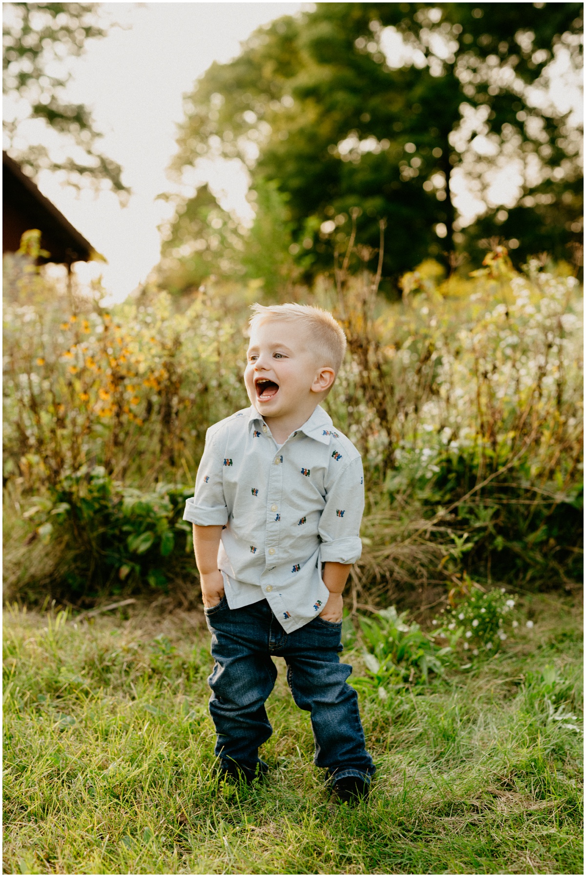 little boy laughing at park