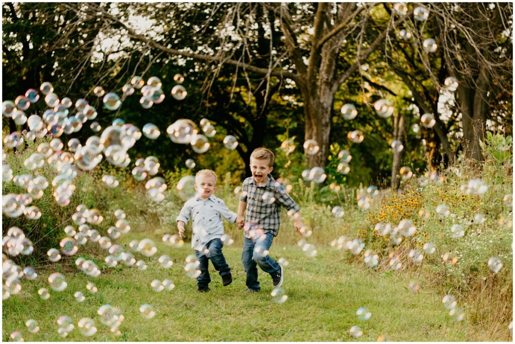 photo of boys playing with bubbles