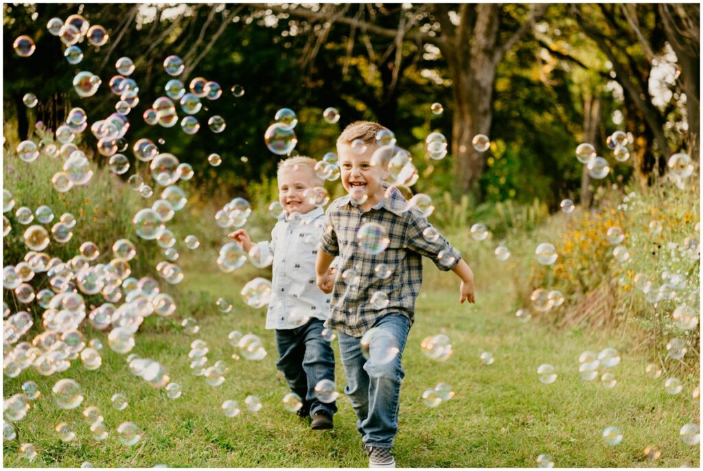 boys running through bubbles