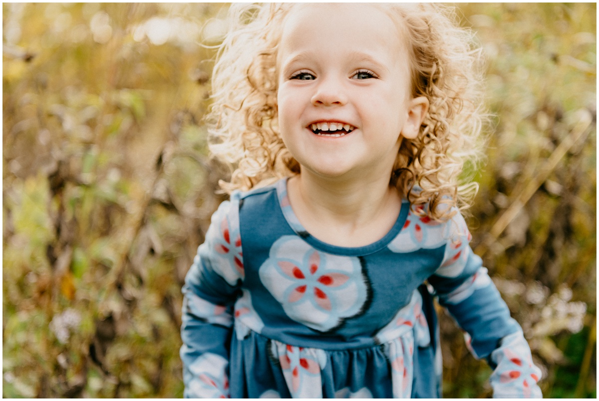 smiling adorable girl with curly hair