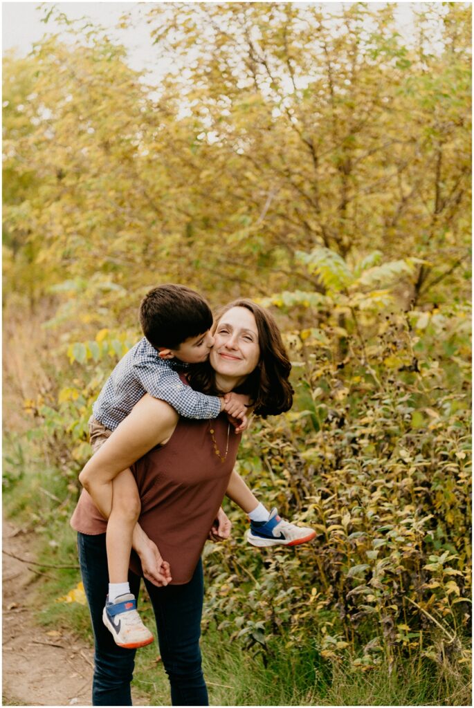 little boy kissing mom