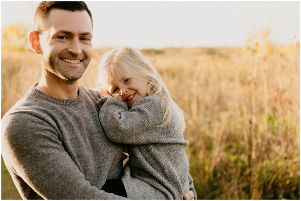 daughter and dad smiling