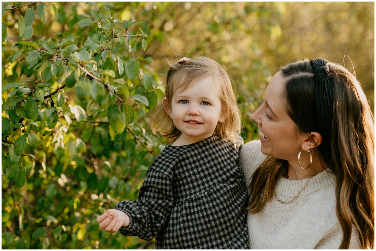 mom with smiling toddler daughter