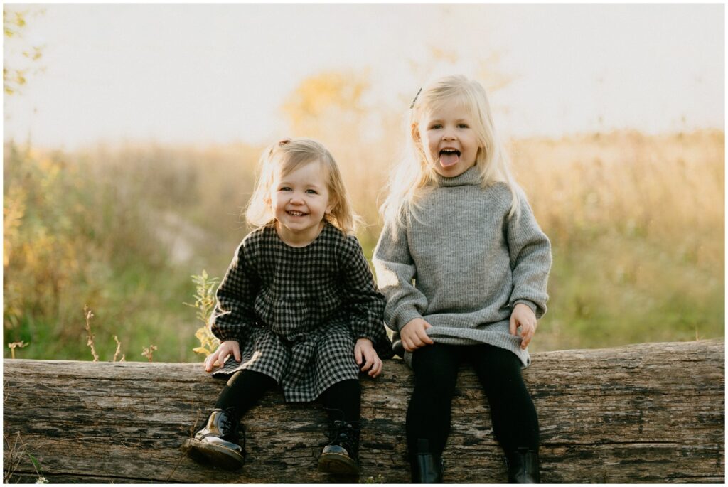 smiling family at a park in the fall