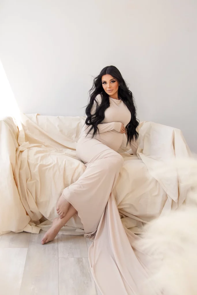 pregnant woman in white long dress with train
