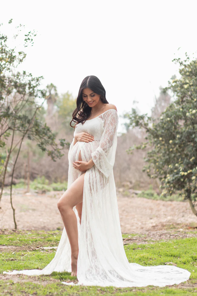 woman in white lace pregnancy gown