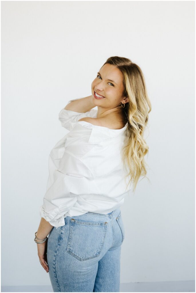girl smiling at camera with blonde hair