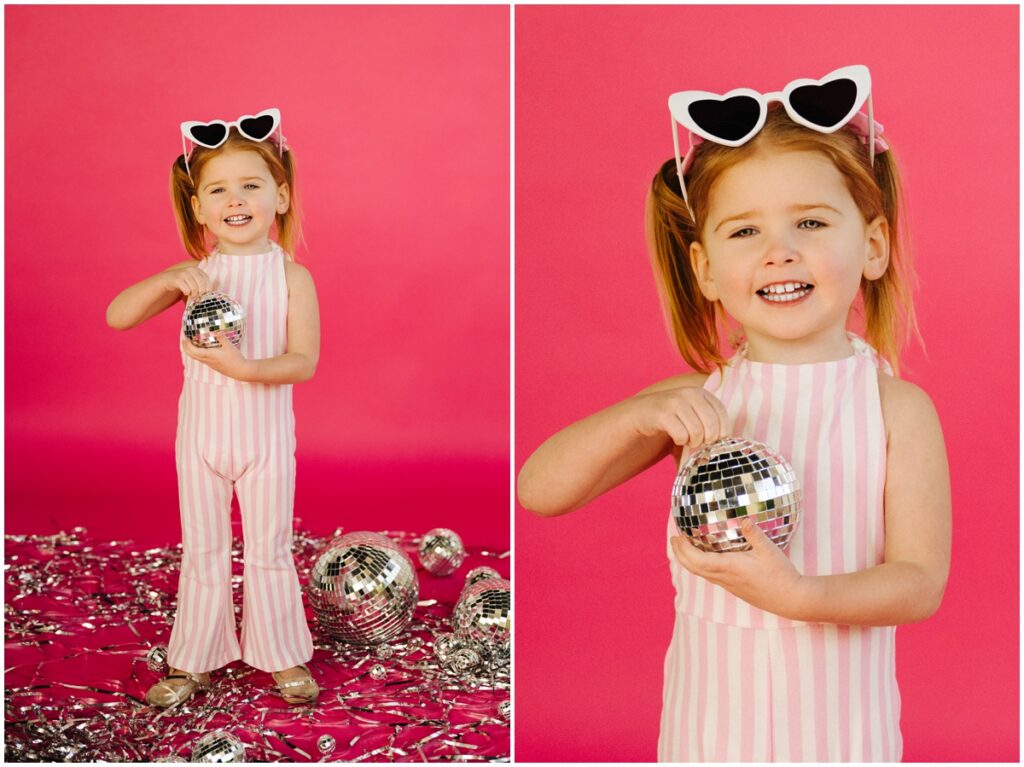 little girl with pink background sunglasses and disco ball