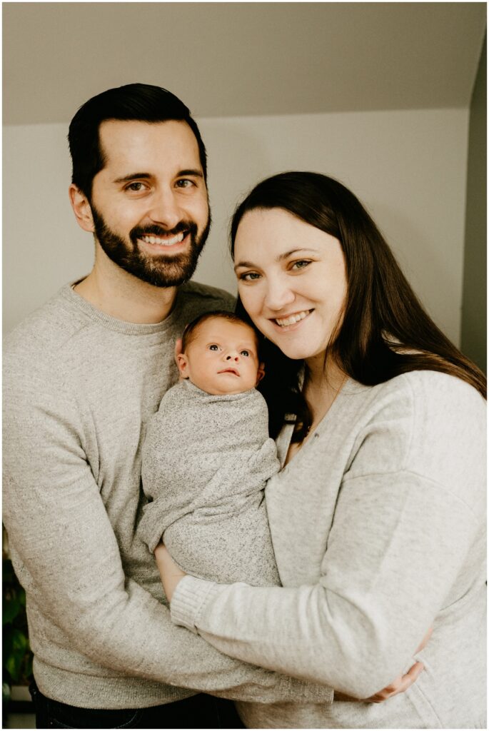 family with baby smiling 