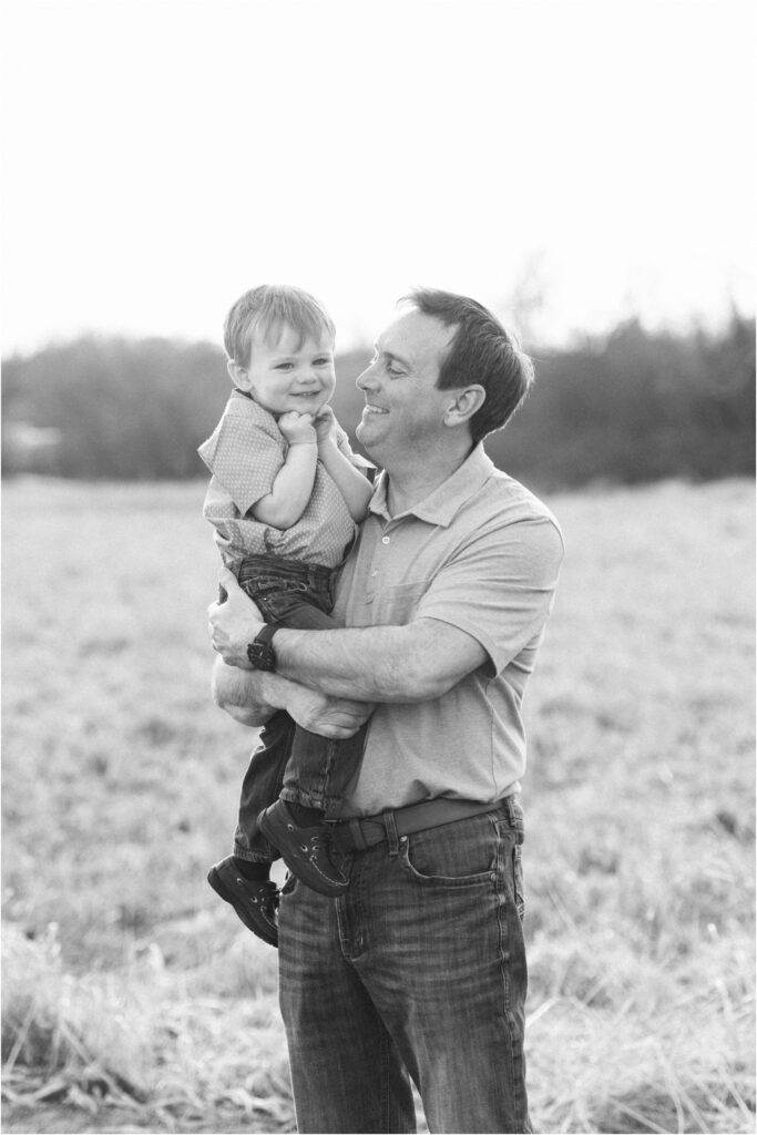 dad and son smiling bw photo