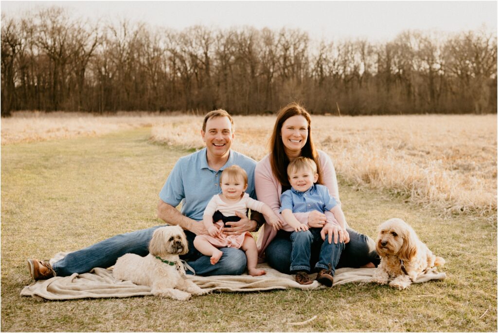 family photo outside with two dogs