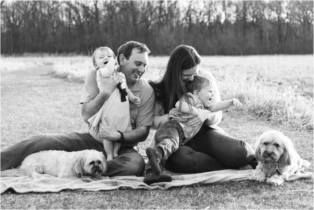 family photo outside tickling kids