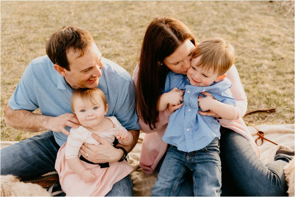 family photo outside tickling kids