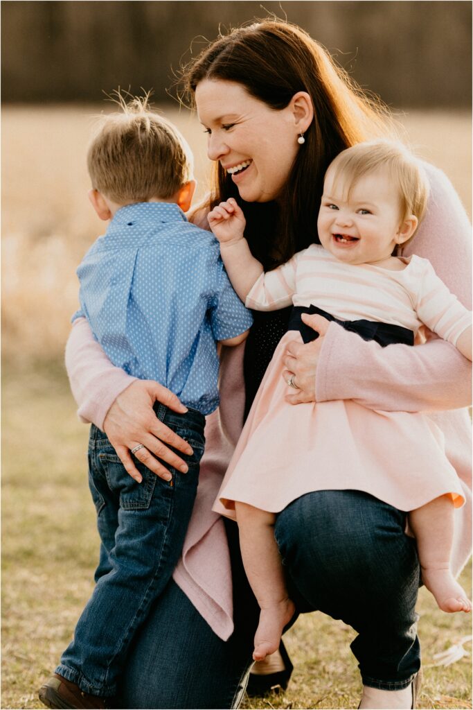 mom holding children