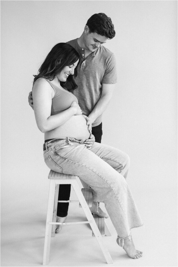 husband and wife black and white maternity photo