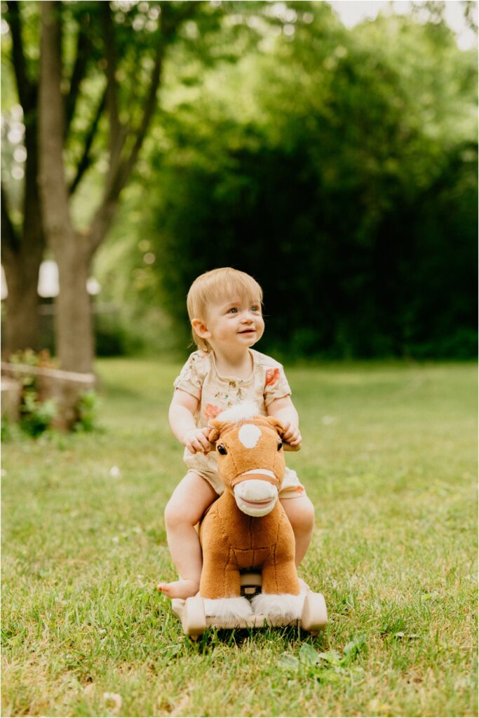 little girl on rocking horse