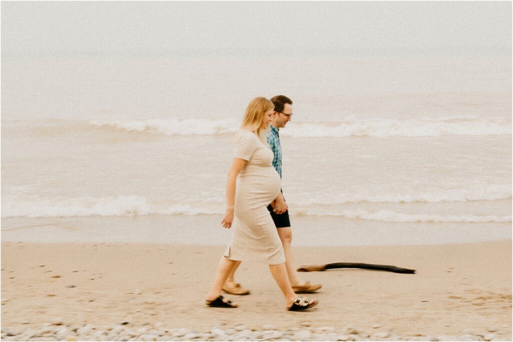 a couple walking on the lake Michigan beach