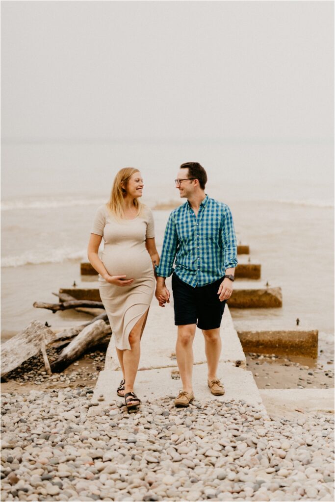 a couple walking on the lake Michigan beach
