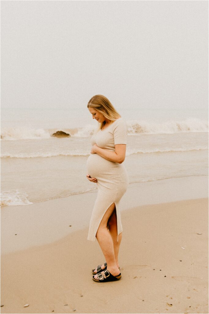 posing pregnant woman by lake Michigan 