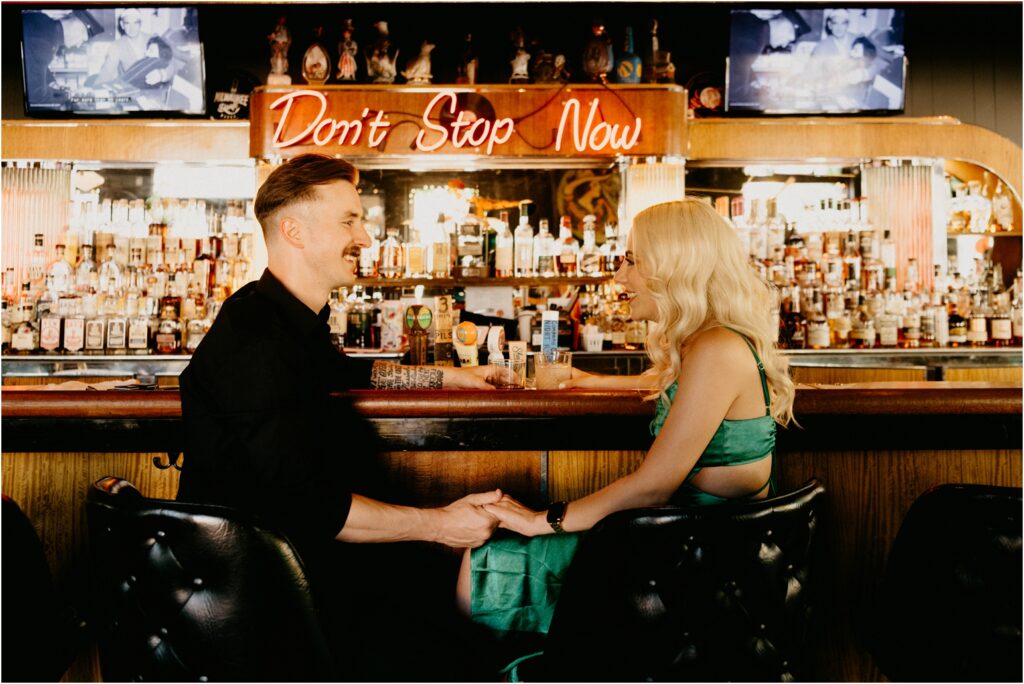 a happy couple at the bar