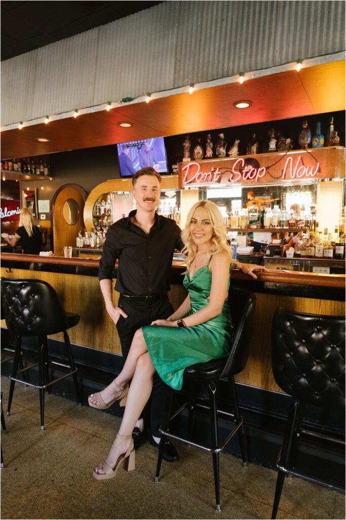 engagement photo of a couple in a bar