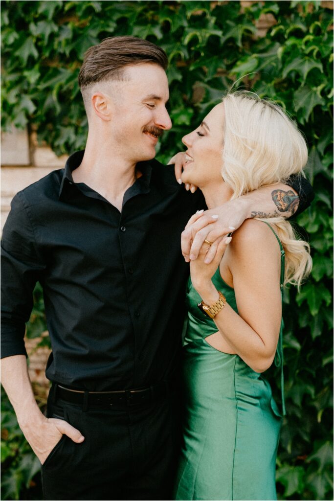 a couple hugging and smiling 