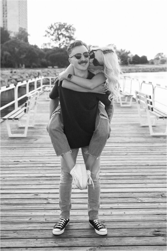 a couple with sunglasses on the dock
