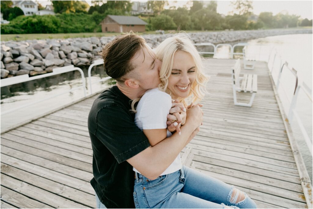 an engagement photo of a couple hugging