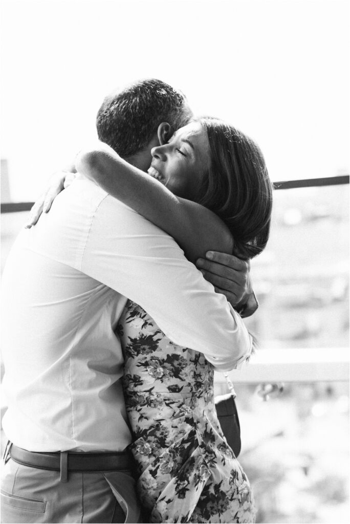 a couple hugging with smiles