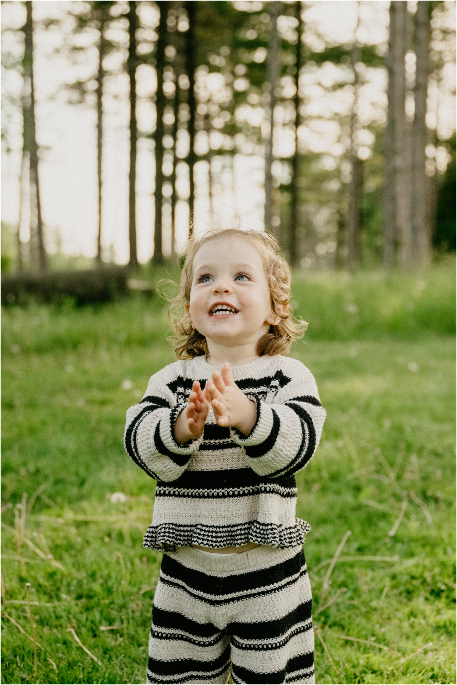 little girl smiling at the park