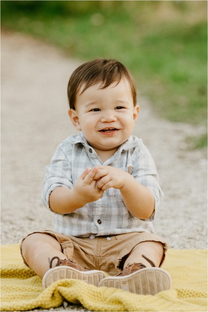 little boy clapping and smiling
