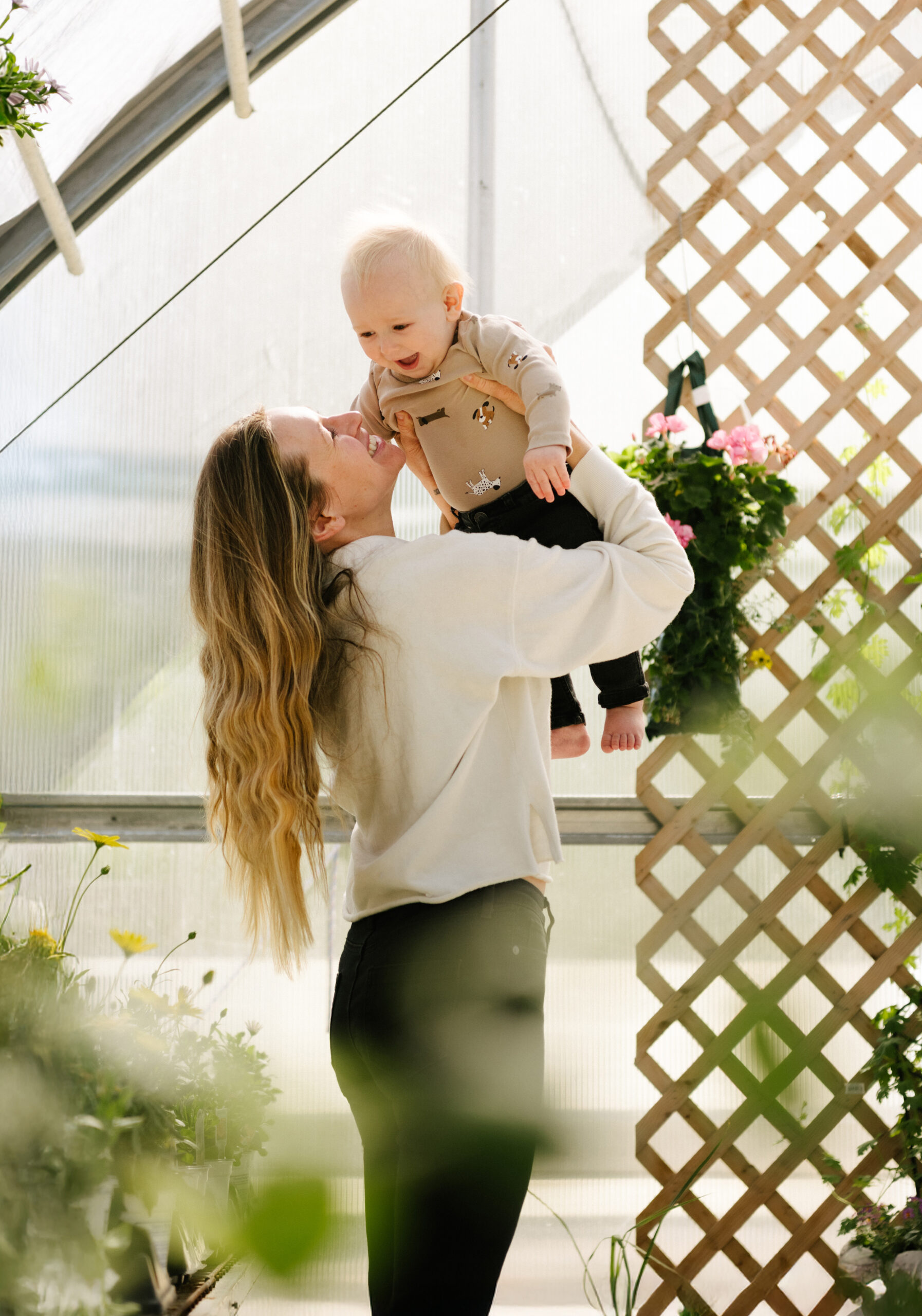 woman smiling holding baby