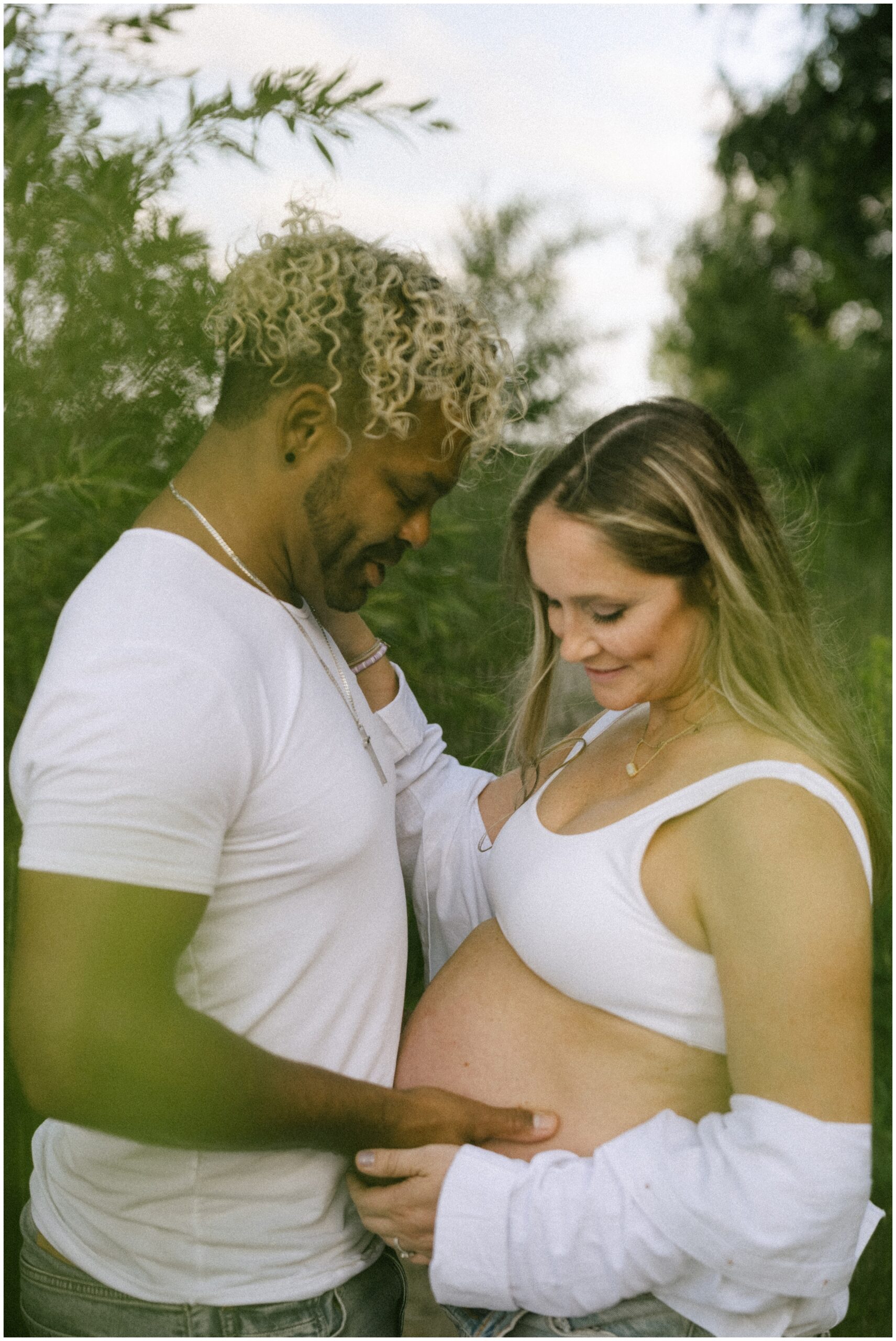 beautiful beach maternity photography with a happy couple