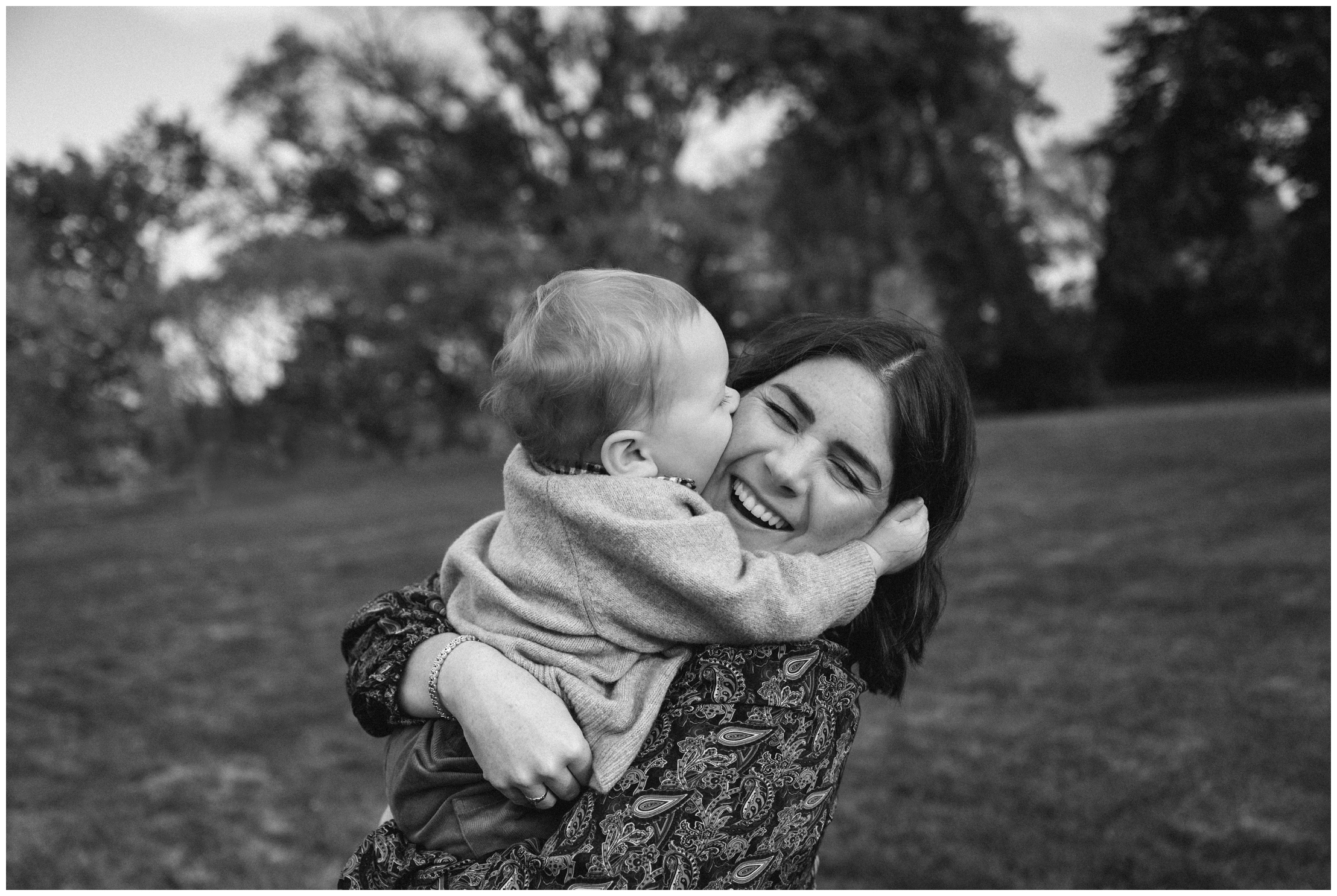 beautiful mother hugging baby boy