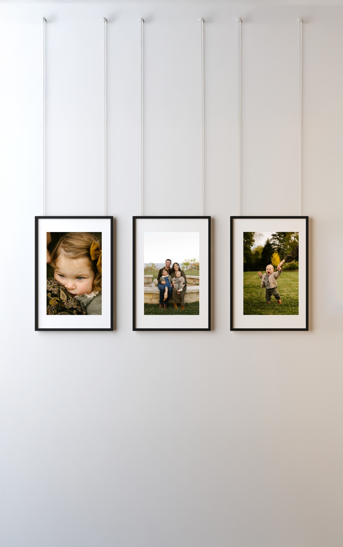 gorgeous family photos hanging on wall