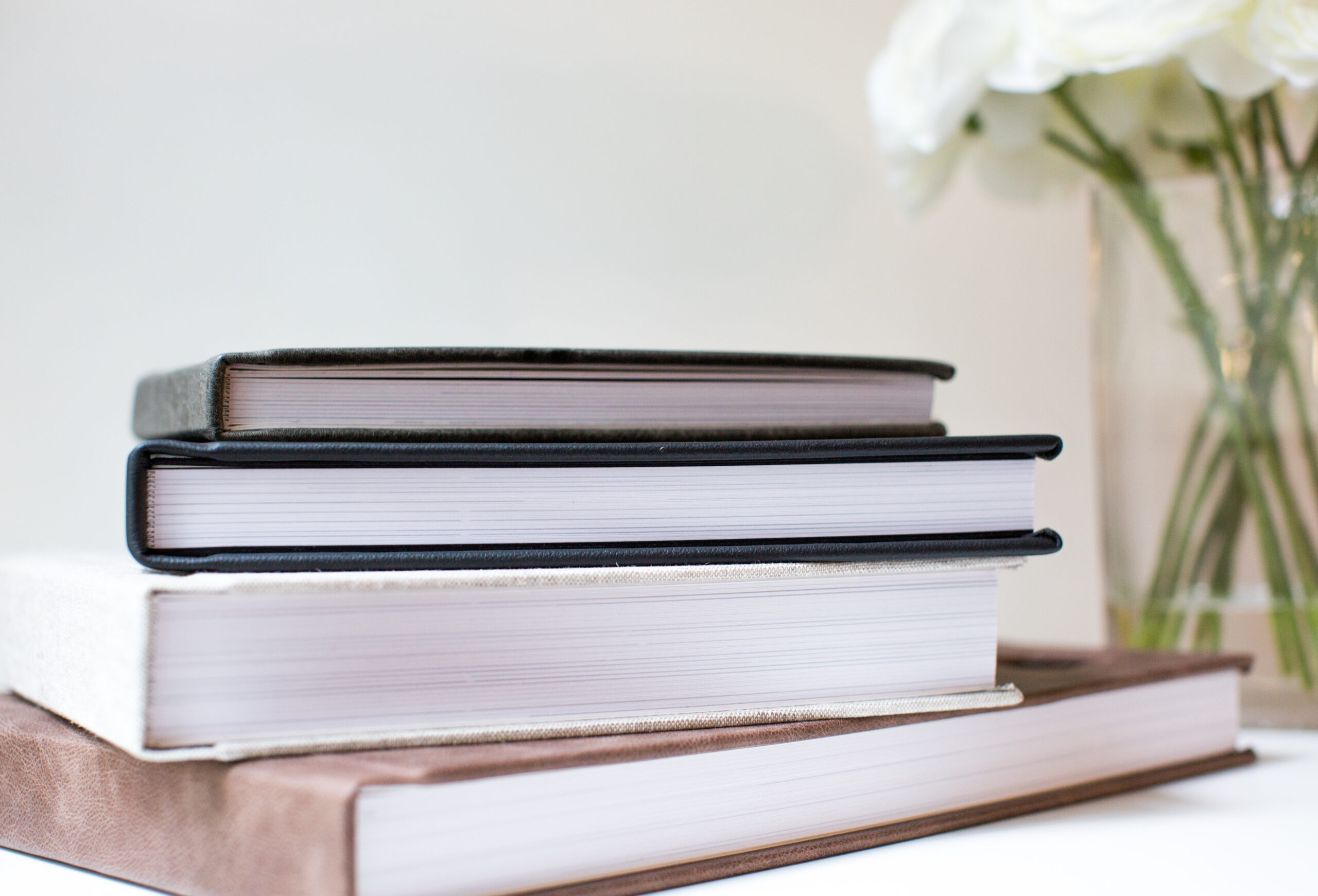 stack of signature printed photo albums